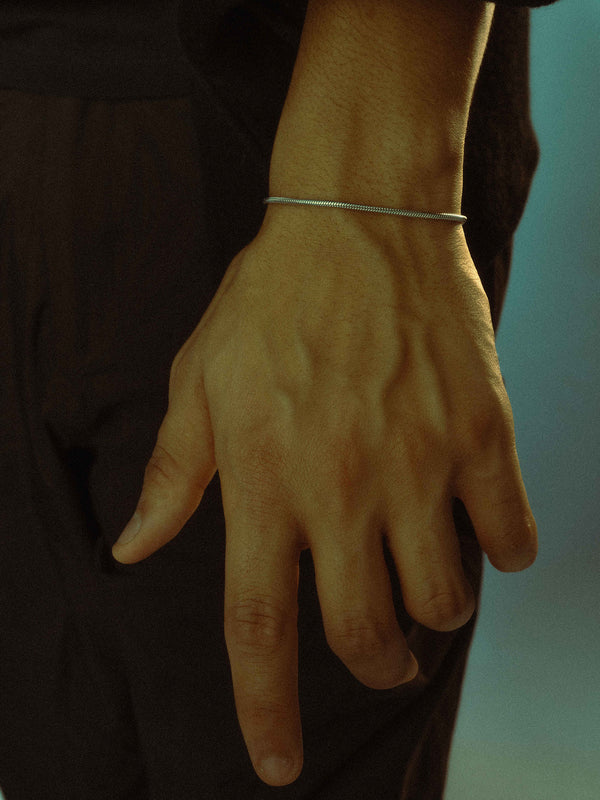 Model is wearing an adjustable bracelet