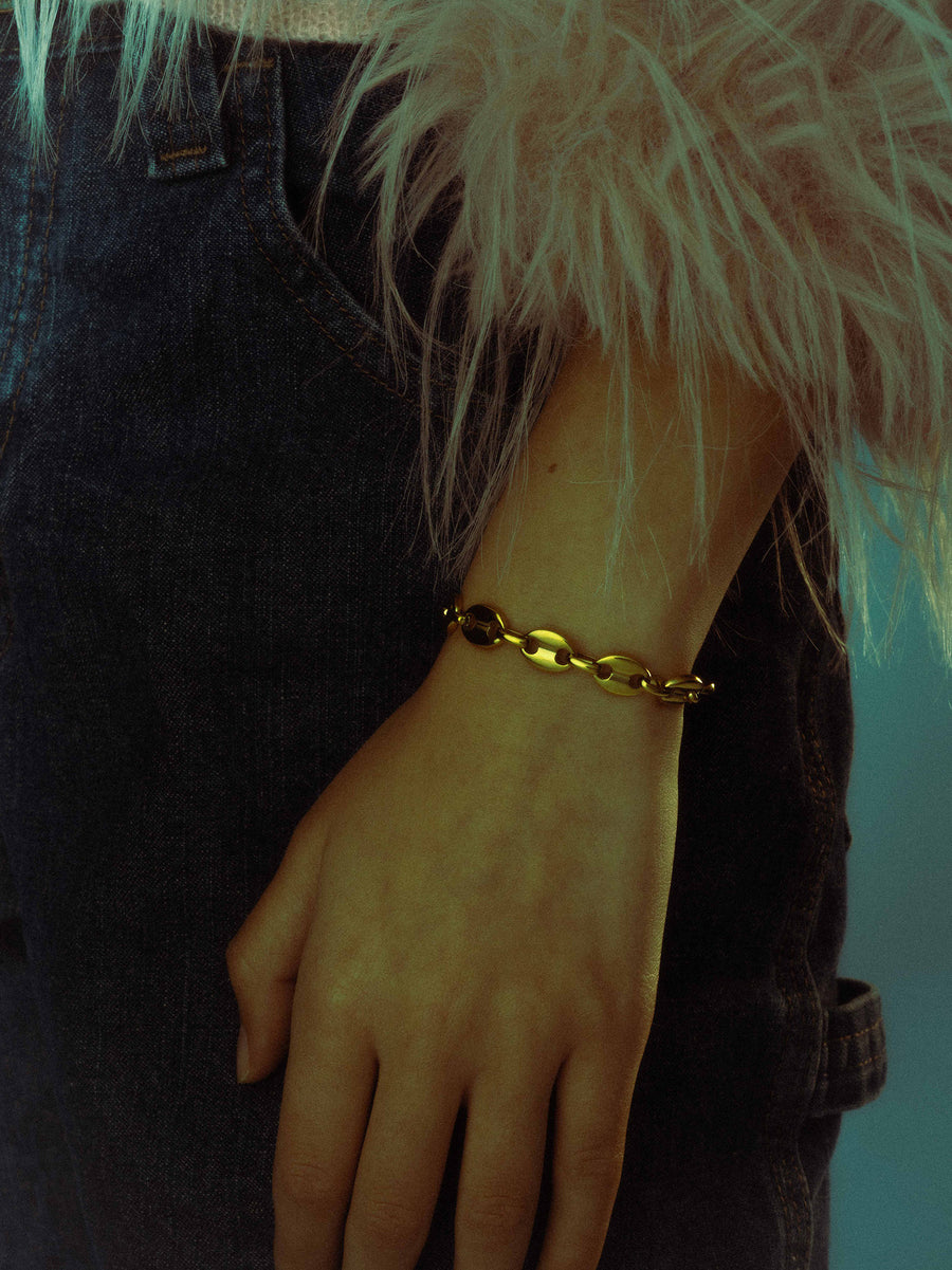 Model is wearing an adjustable bracelet