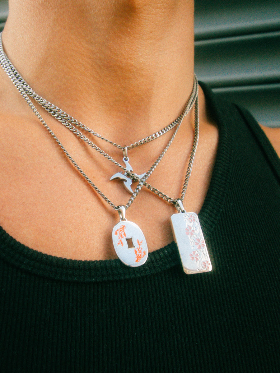Koi Fish pendant shown with the Sakura and Shuriken designs